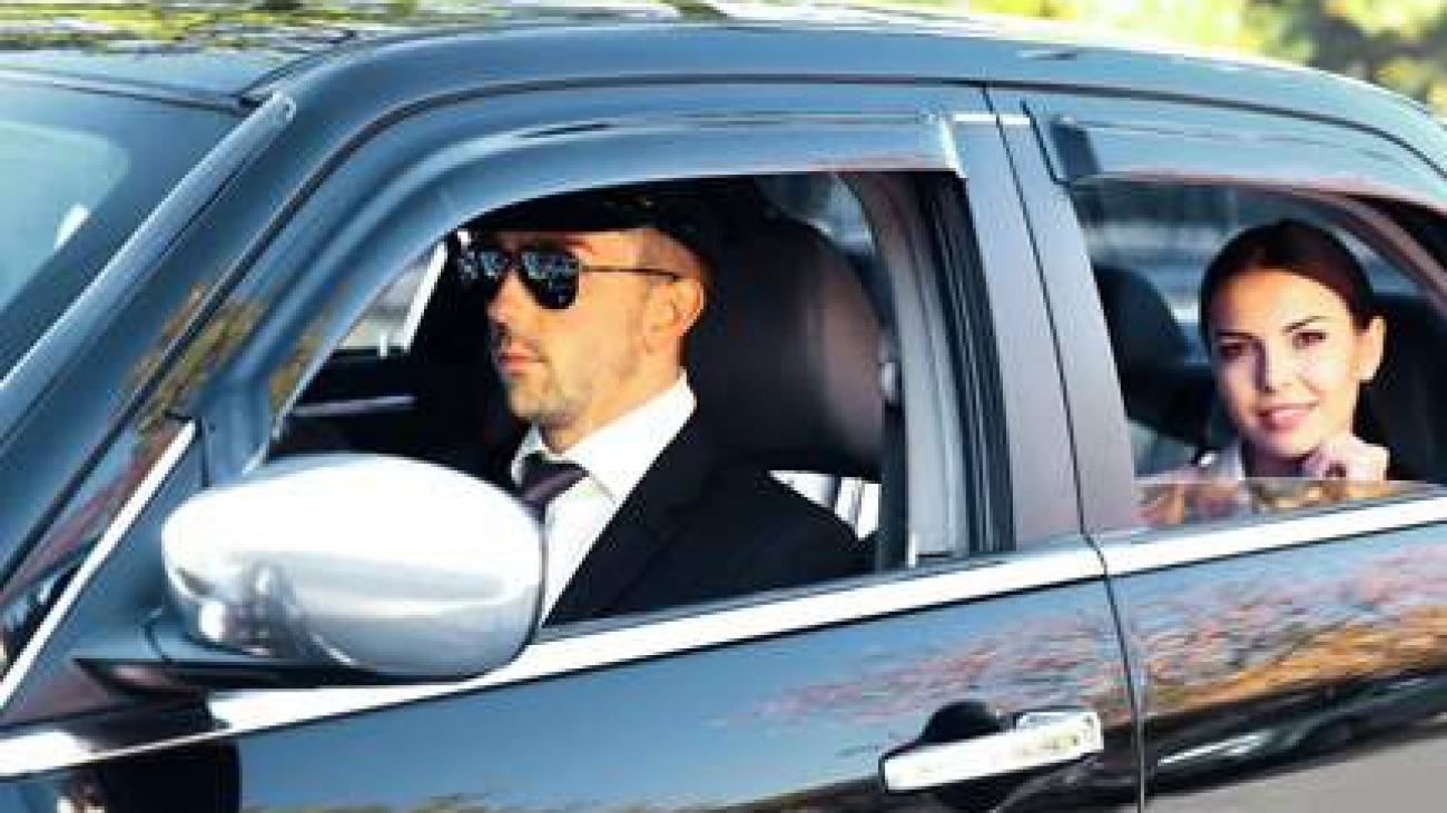 business lady in executive sedan